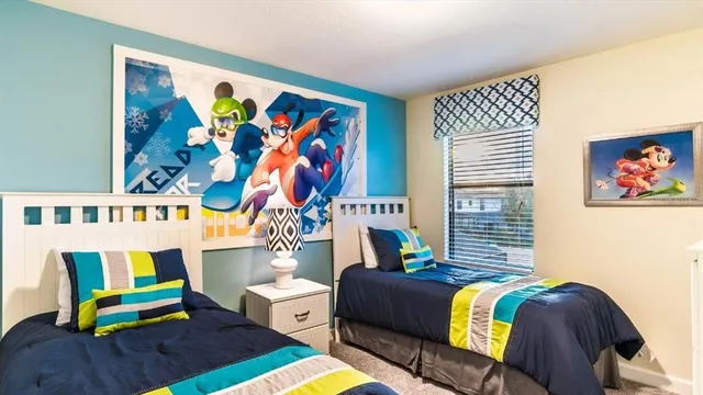 a living room with furniture and wall paintings