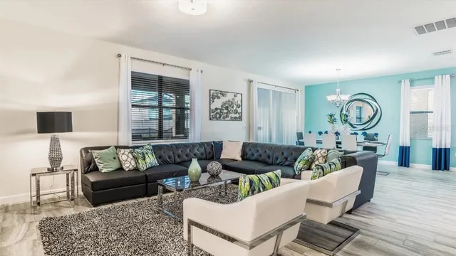 a living room with furniture and a large window