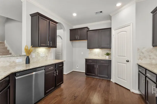a kitchen with stainless steel appliances granite countertop counter space a sink and cabinets
