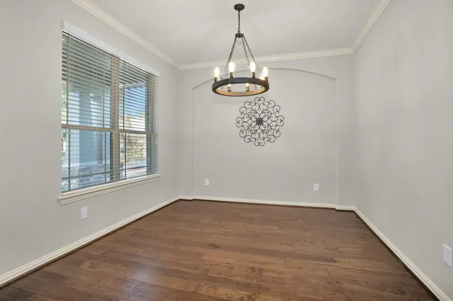 a kitchen with stainless steel appliances granite countertop a stove top oven a sink dishwasher a refrigerator and a microwave