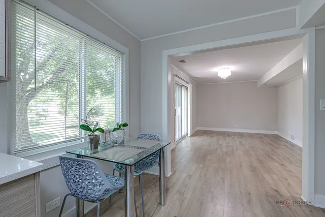 a workspace room with furniture and windows