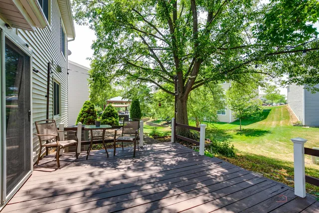 a view of backyard with seating and green space