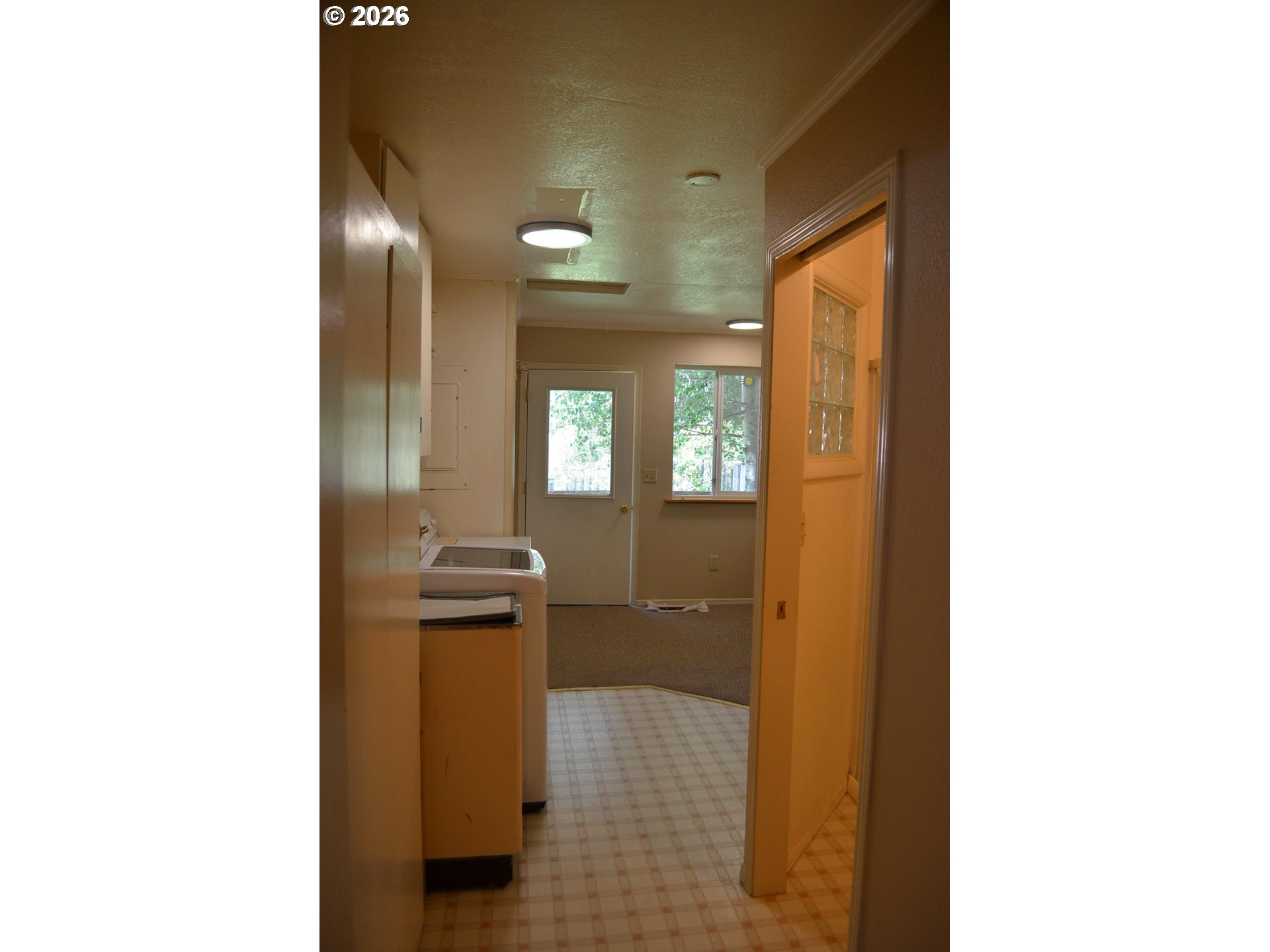 137008 Main Street Crescent, OR 97733 - Photo 15 of 47 a view of a hallway with windows and a bathroom