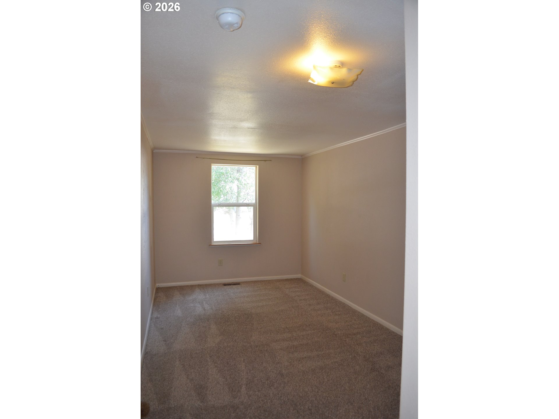 137008 Main Street Crescent, OR 97733 - Photo 19 of 47 a view of an empty room with a window