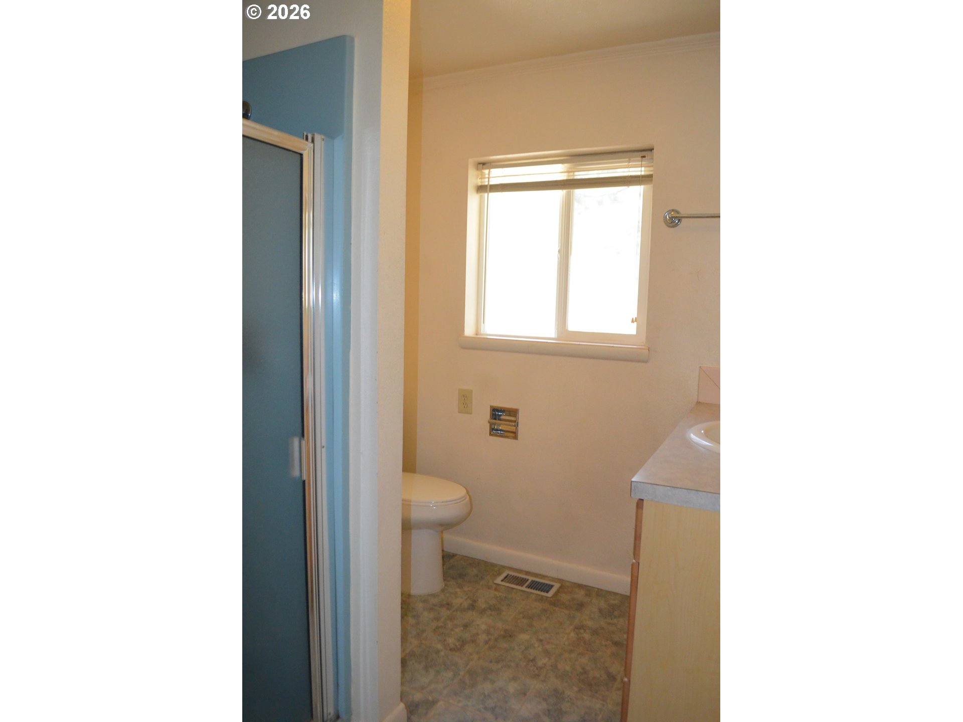137008 Main Street Crescent, OR 97733 - Photo 31 of 47 a bathroom with a toilet a window and a shower