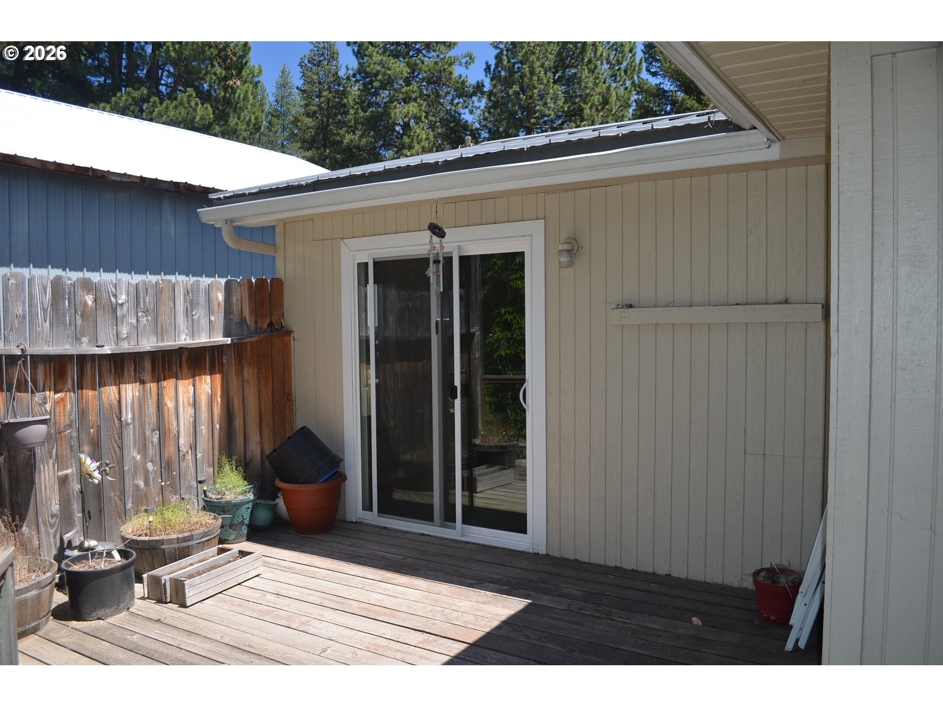 137008 Main Street Crescent, OR 97733 - Photo 33 of 47 a view of backyard with outdoor seating and plants