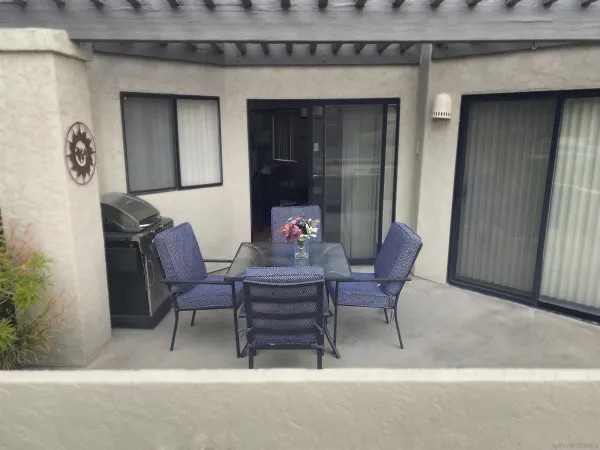 a view of a dining room with furniture and window