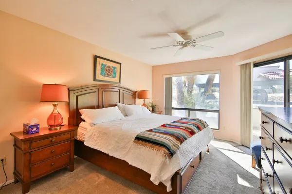 a bedroom with a bed and window