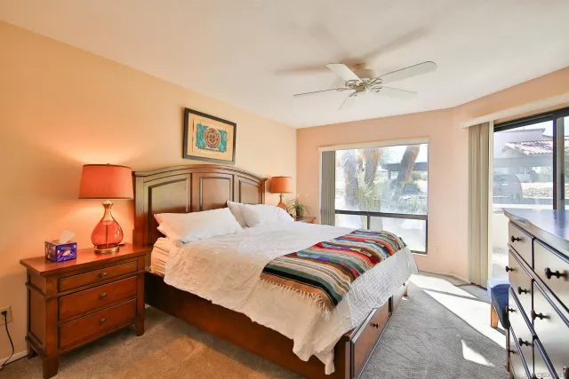 a bedroom with a bed and window