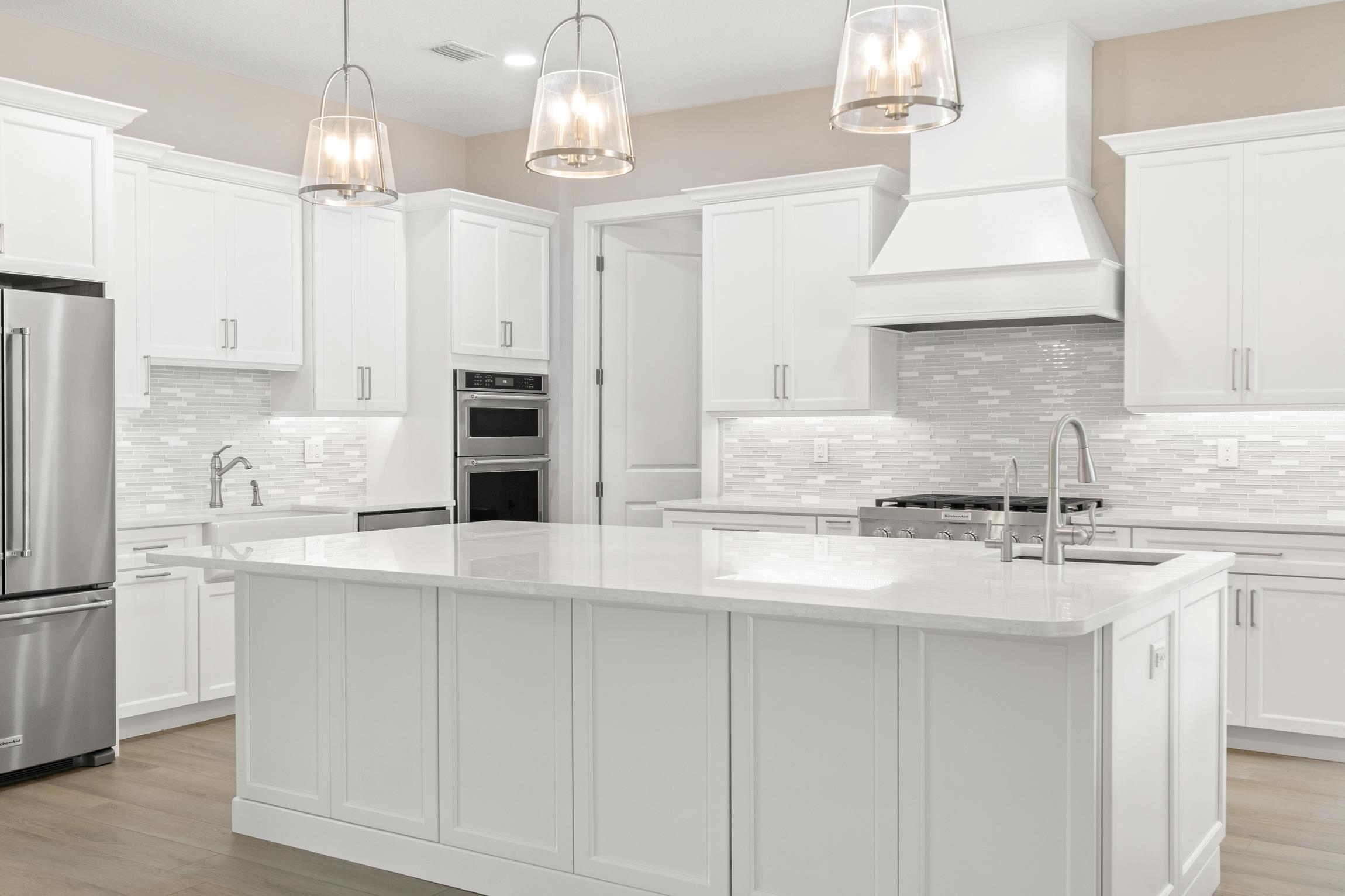 129 16th Street St. Augustine, FL 32080 - Photo 13 of 34 a kitchen with stainless steel appliances granite countertop a sink a stove a refrigerator and cabinets