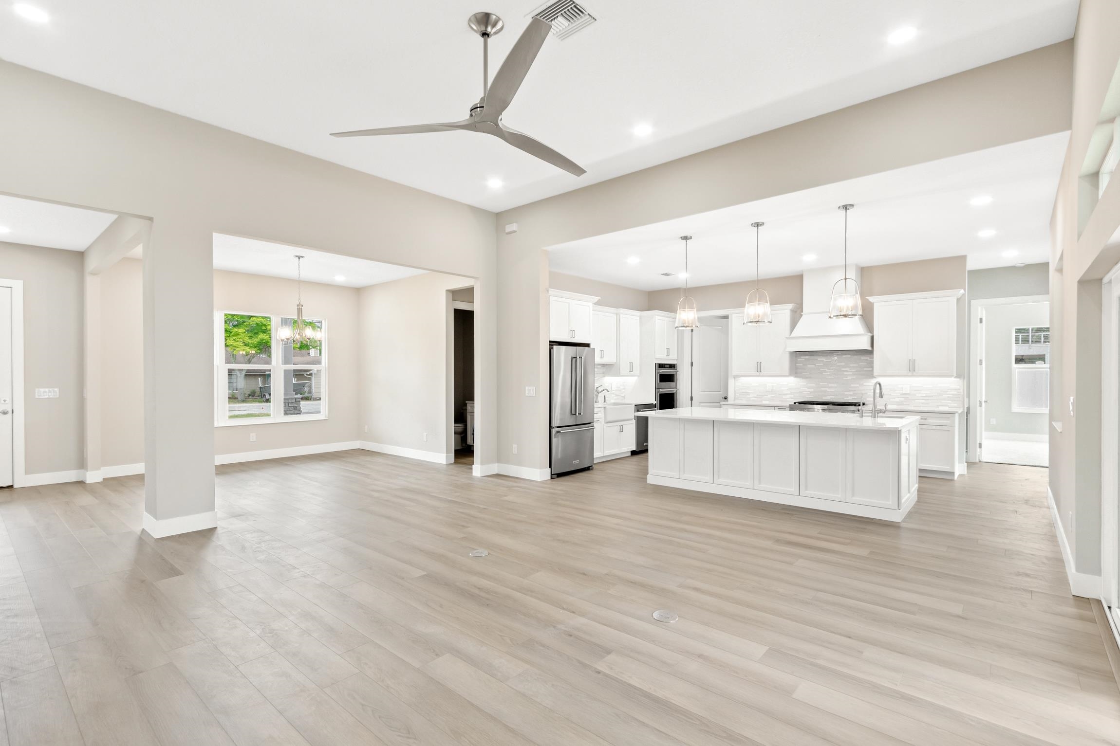 129 16th Street St. Augustine, FL 32080 - Photo 16 of 34 a view of kitchen with wooden floor and electronic appliances