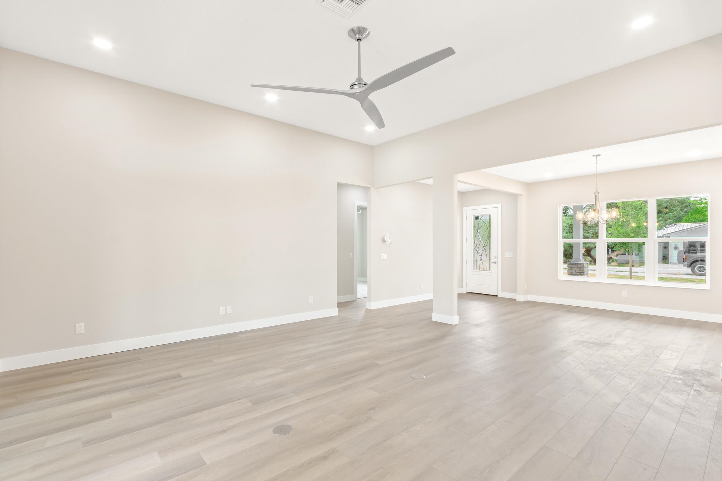 129 16th Street St. Augustine, FL 32080 - Photo 17 of 34 a view of an empty room with wooden floor and a window