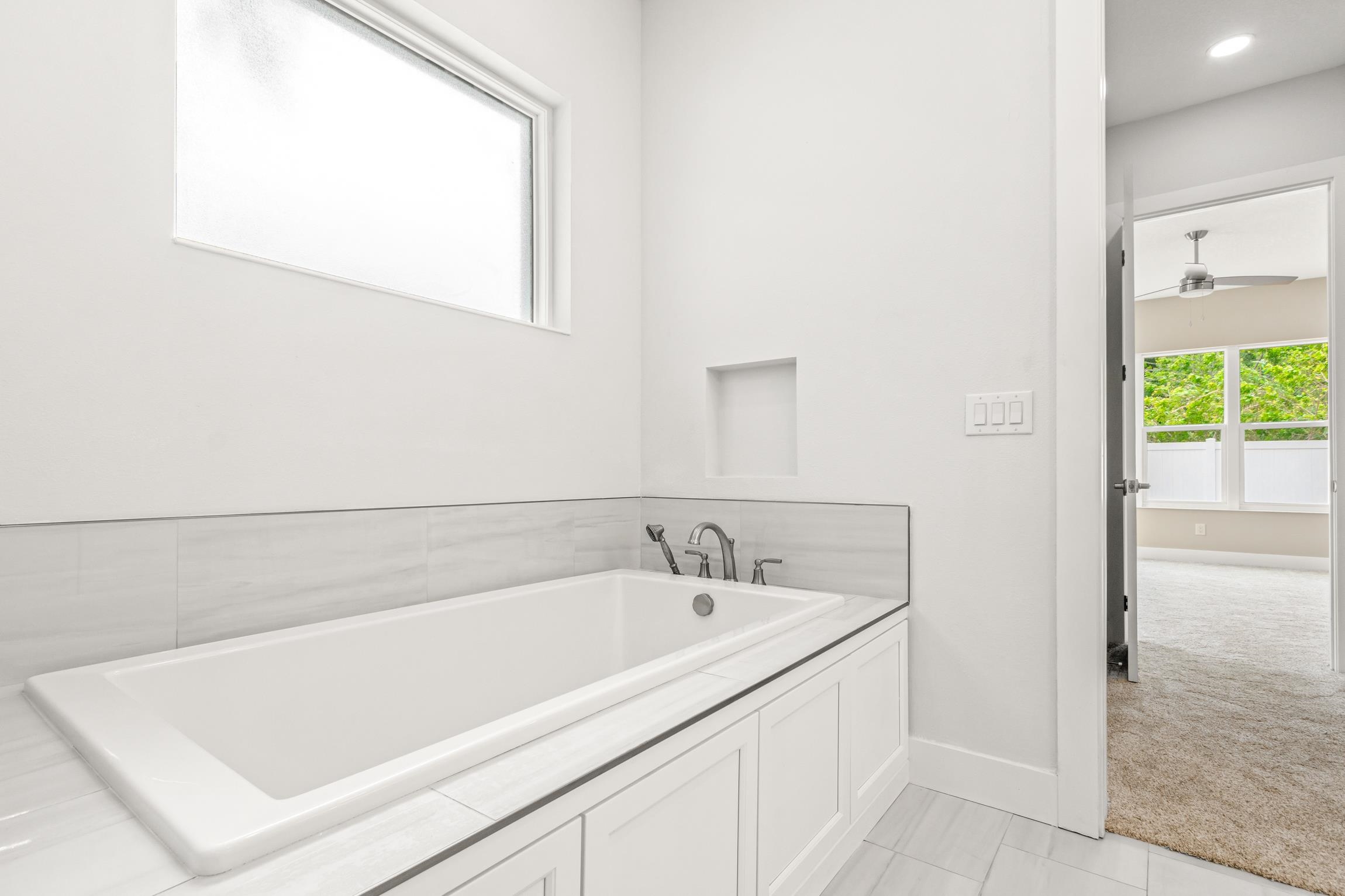 129 16th Street St. Augustine, FL 32080 - Photo 26 of 34 a bath tub sitting next to a white sink