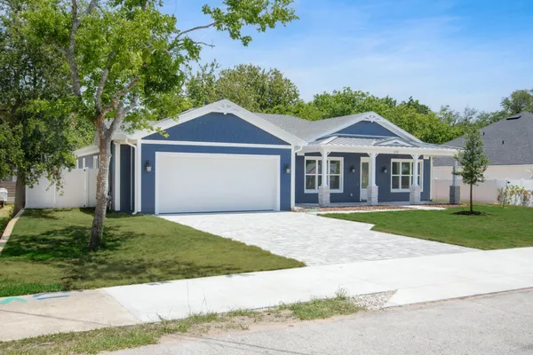 a house view with a garden space