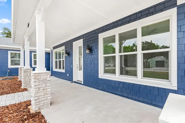 a kitchen with stainless steel appliances granite countertop wooden floors sink and cabinets