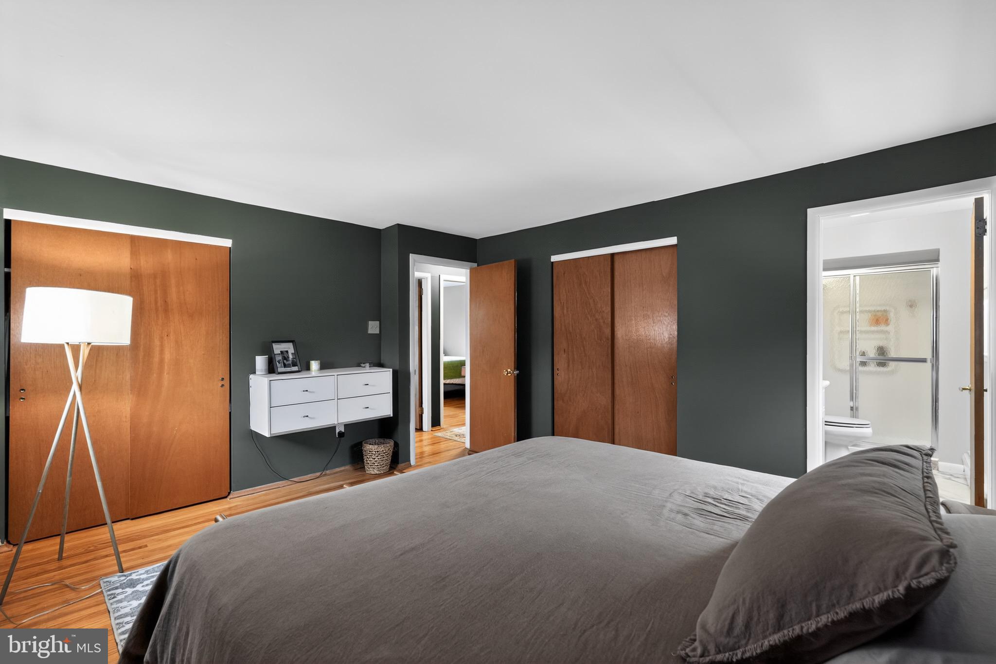 4517 East Yates Road Bensalem, PA 19020 - Photo 11 of 23 a bedroom with a bed and dresser with mirror