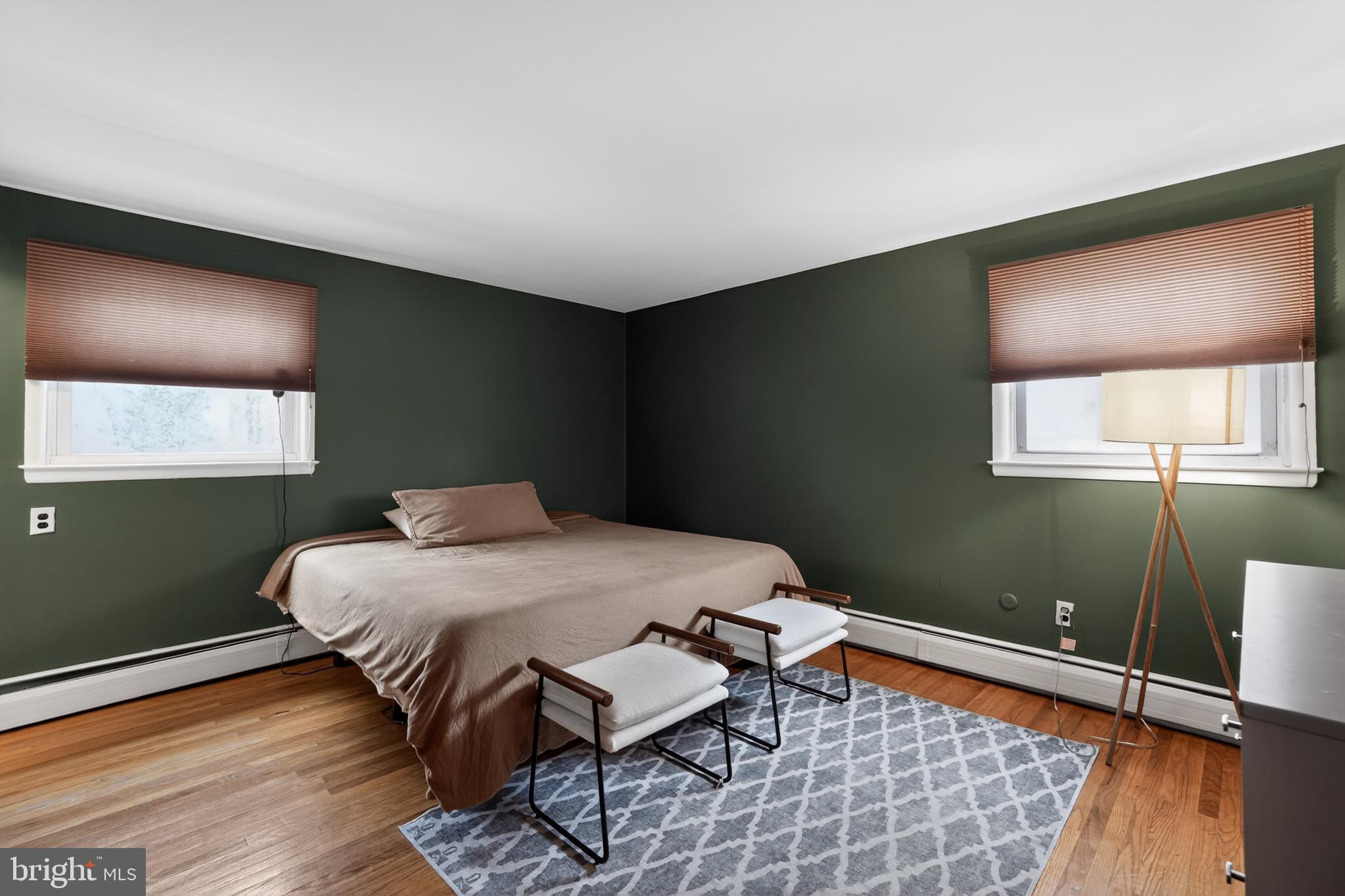 4517 East Yates Road Bensalem, PA 19020 - Photo 13 of 23 a bedroom with a bed and wooden floor