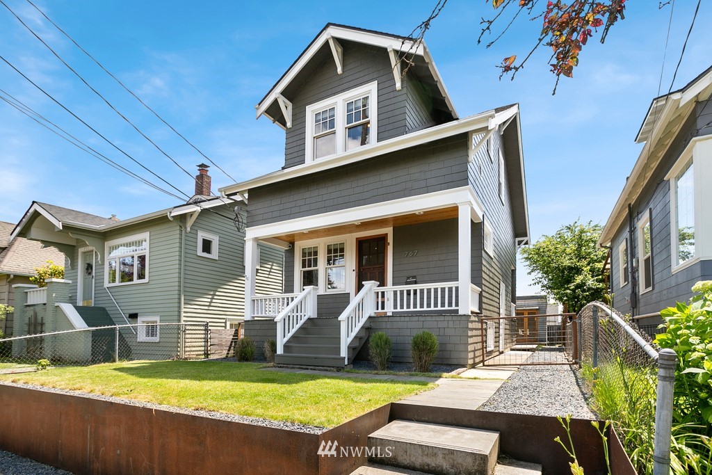 767 North 75th Street Seattle, WA 98103 - Photo 1 of 25 a view of house with yard outdoor seating and barbeque oven