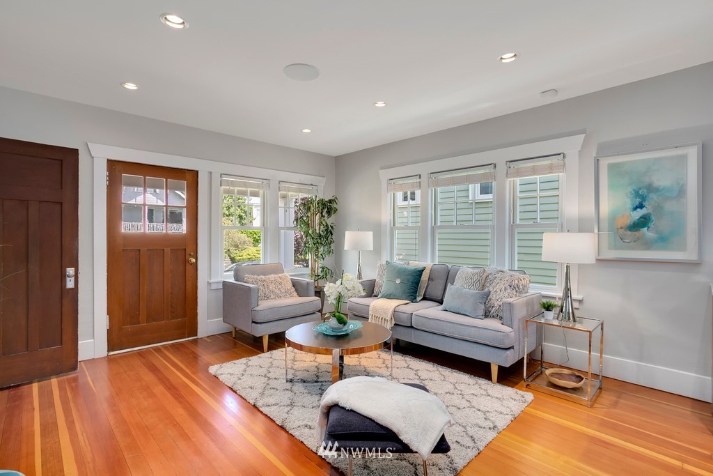 767 North 75th Street Seattle, WA 98103 - Photo 2 of 25 a living room with furniture and a large window