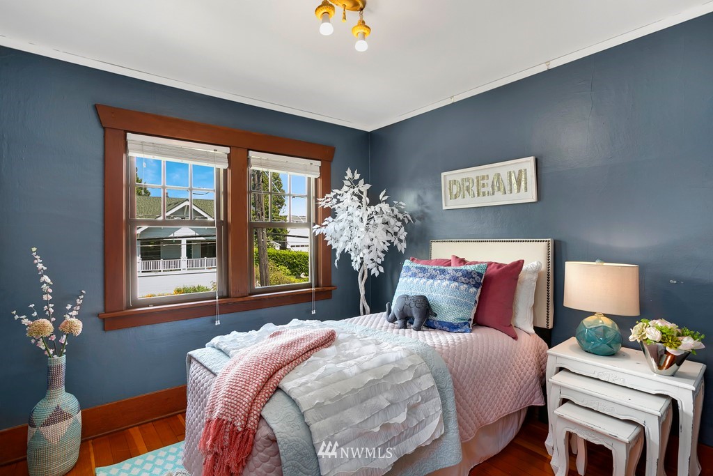 767 North 75th Street Seattle, WA 98103 - Photo 11 of 25 a bedroom with bed and a window