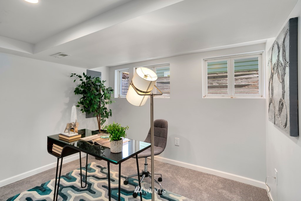 767 North 75th Street Seattle, WA 98103 - Photo 14 of 25 a dining room with furniture and window
