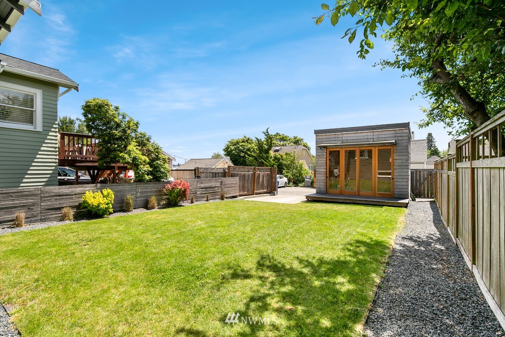 767 North 75th Street Seattle, WA 98103 - Photo 17 of 25 a view of a house with backyard and porch