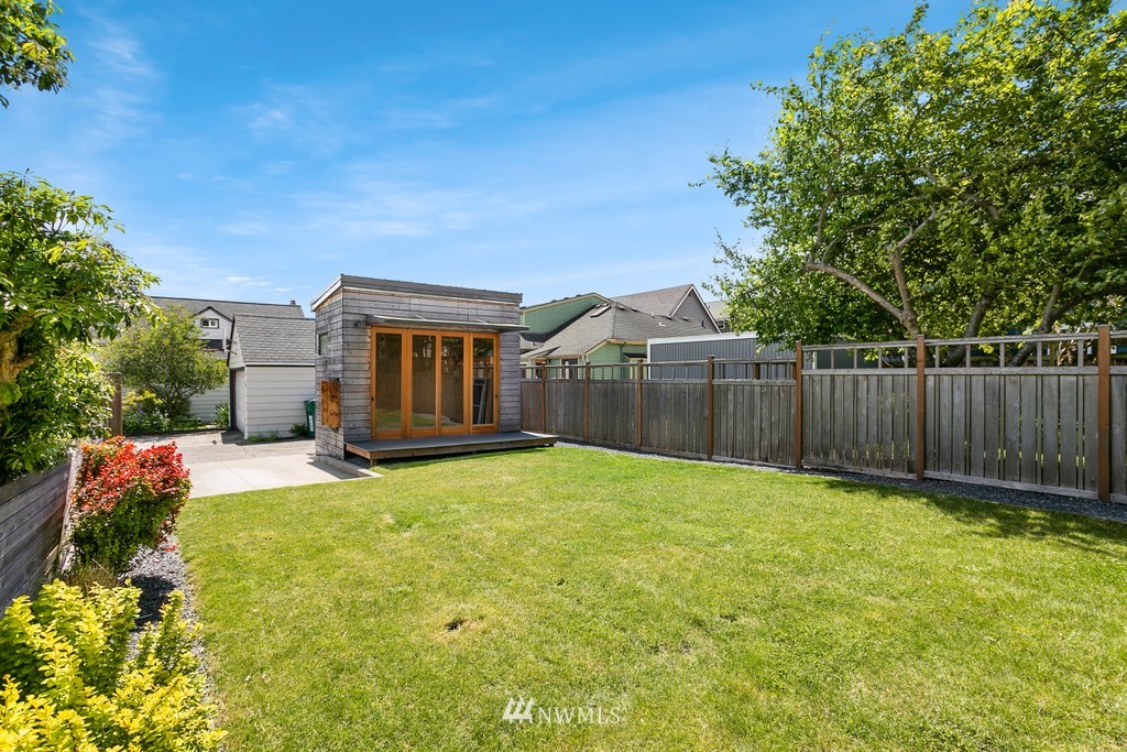 767 North 75th Street Seattle, WA 98103 - Photo 18 of 25 a view of a house with backyard and a tree
