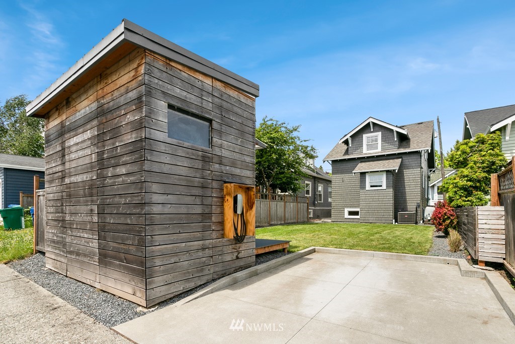 767 North 75th Street Seattle, WA 98103 - Photo 19 of 25 a view of a house with a small yard and plants