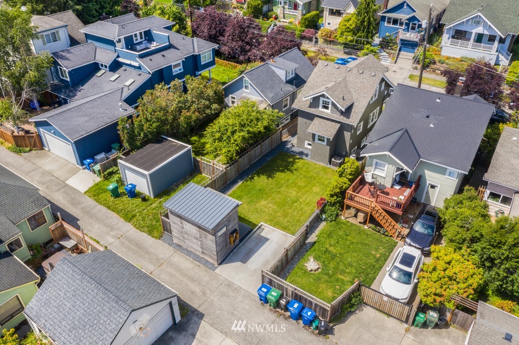767 North 75th Street Seattle, WA 98103 - Photo 23 of 25 an aerial view of a house with a swimming pool yard and outdoor seating