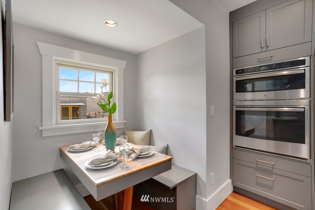 767 North 75th Street Seattle, WA 98103 - Photo 8 of 25 a white stove top oven sitting inside of a kitchen