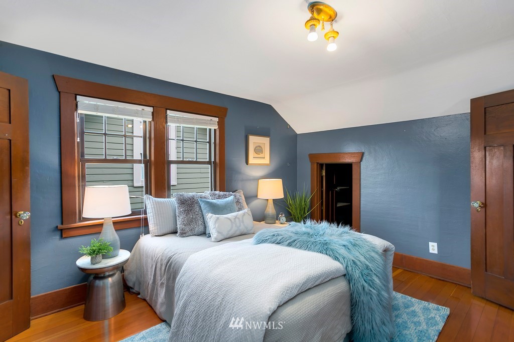 767 North 75th Street Seattle, WA 98103 - Photo 10 of 25 a bedroom with a bed and a window
