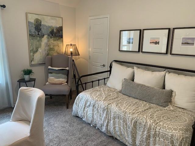 712 Feldspar Way Princeton, TX 75407 - Photo 3 of 12 Neutral-toned room featuring light gray carpeting, crisp white walls, and a white interior door