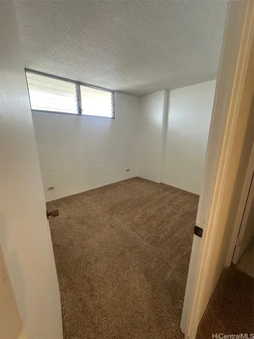 an empty room with a empty space and window