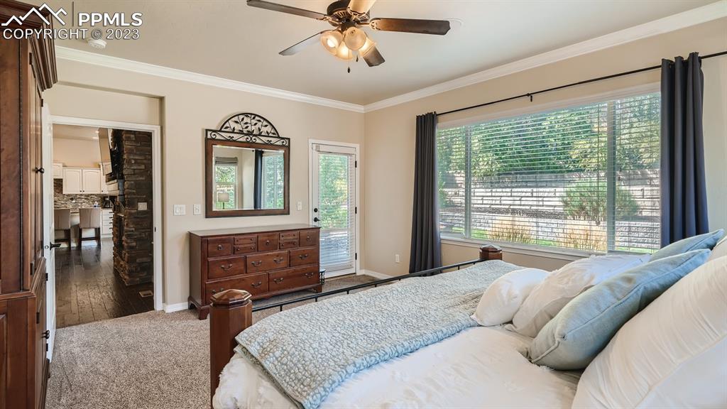 1118 Spectrum Loop Colorado Springs, CO 80921 - Photo 12 of 30 a bedroom with a bed and a dresser