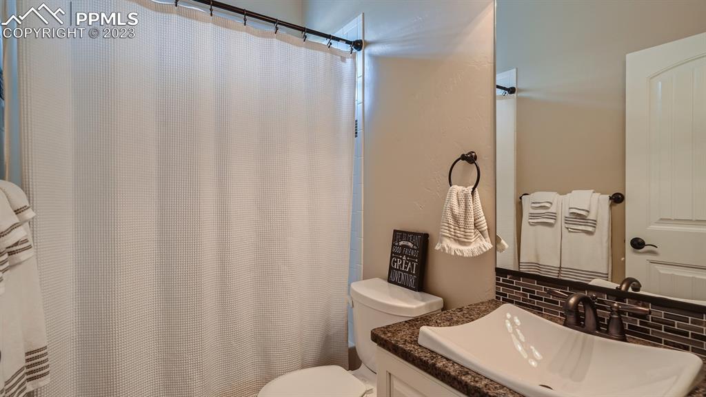 1118 Spectrum Loop Colorado Springs, CO 80921 - Photo 16 of 30 a bathroom with a sink toilet and shower