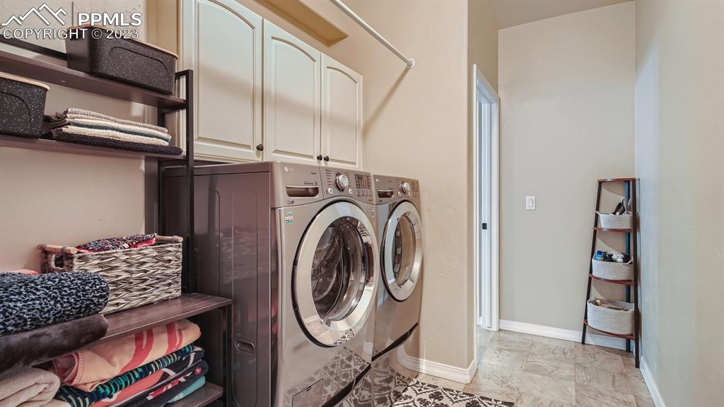 1118 Spectrum Loop Colorado Springs, CO 80921 - Photo 23 of 30 a utility room with dryer and washer