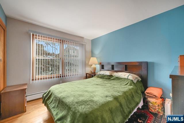 68 Bergen Turnpike Ridgefield Park, NJ 07660 - Photo 14 of 35 a bedroom with a bed and a window