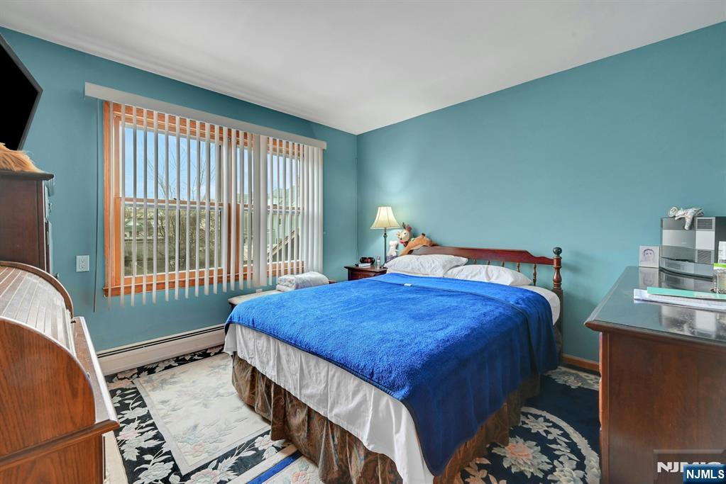 68 Bergen Turnpike Ridgefield Park, NJ 07660 - Photo 15 of 35 a bedroom with a bed and a window