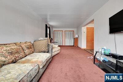 68 Bergen Turnpike Ridgefield Park, NJ 07660 - Photo 16 of 35 a living room with furniture and a flat screen tv