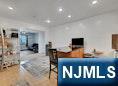 68 Bergen Turnpike Ridgefield Park, NJ 07660 - Photo 25 of 35 a bedroom with furniture and a flat screen tv