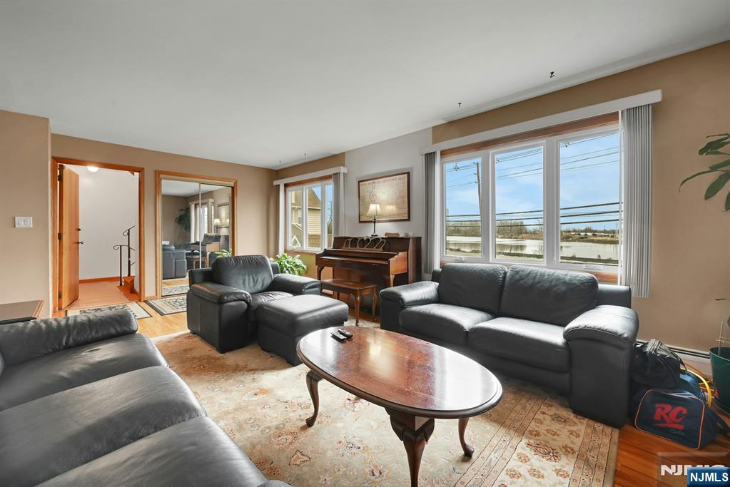 68 Bergen Turnpike Ridgefield Park, NJ 07660 - Photo 4 of 35 a living room with furniture and a large window