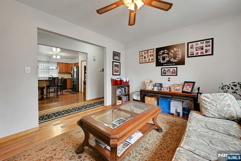 68 Bergen Turnpike Ridgefield Park, NJ 07660 - Photo 7 of 35 a living room with furniture and a flat screen tv