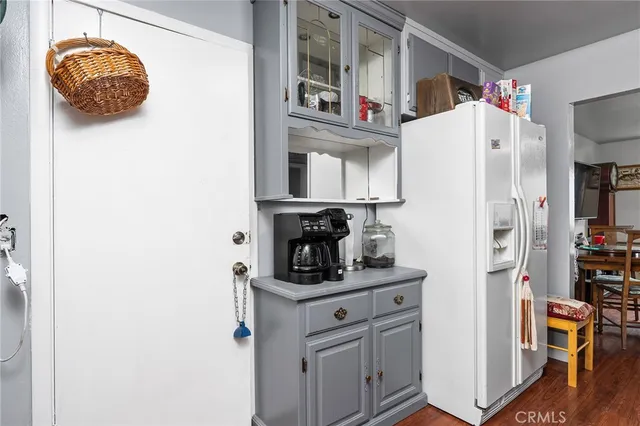 a kitchen with stainless steel appliances a refrigerator and cabinets