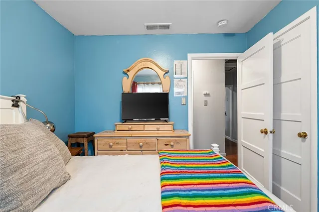 a room that has a bed and a table in it