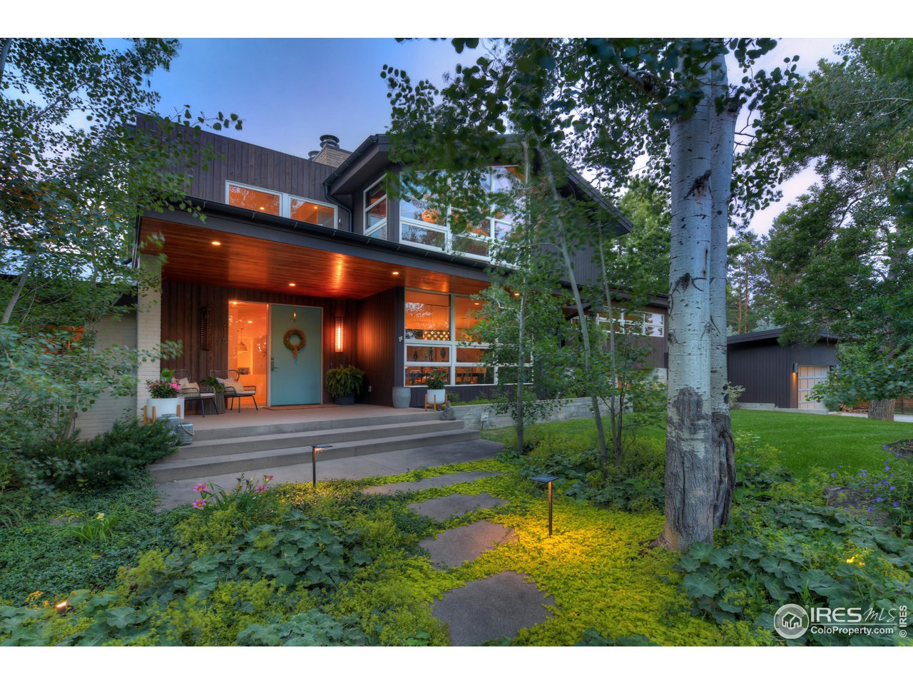 a view of a house with a small yard