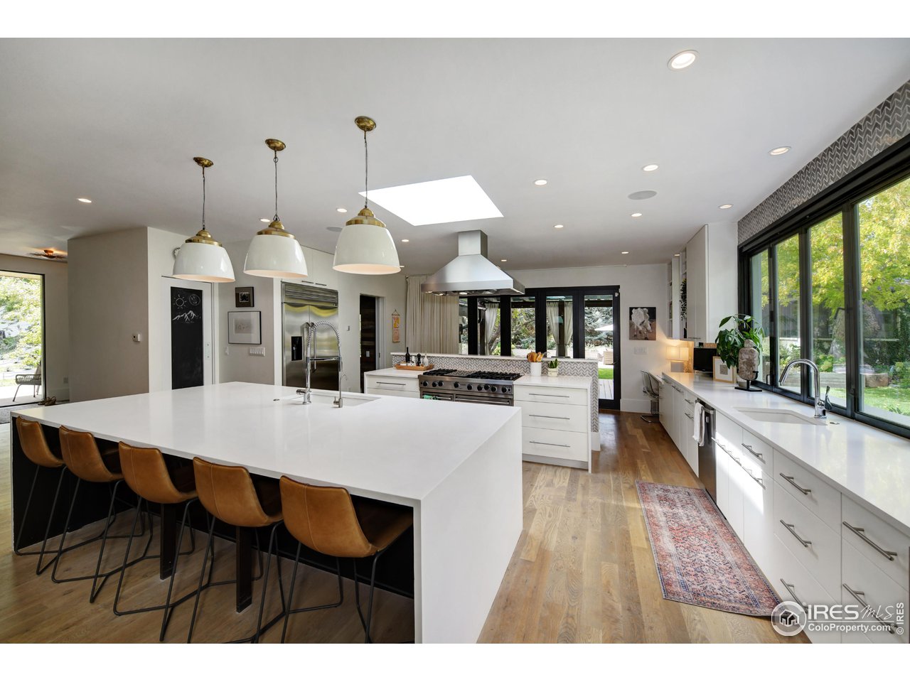 2115 Linden Avenue Boulder, CO 80304 - Photo 11 of 40 a large kitchen with furniture and a table
