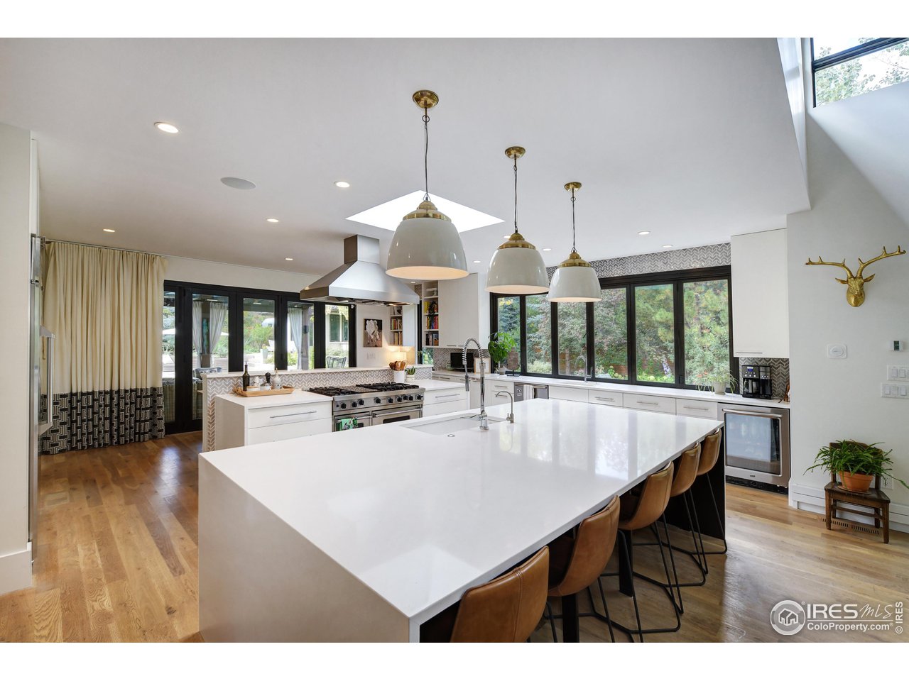 2115 Linden Avenue Boulder, CO 80304 - Photo 13 of 40 a kitchen with kitchen island a dining table and chairs