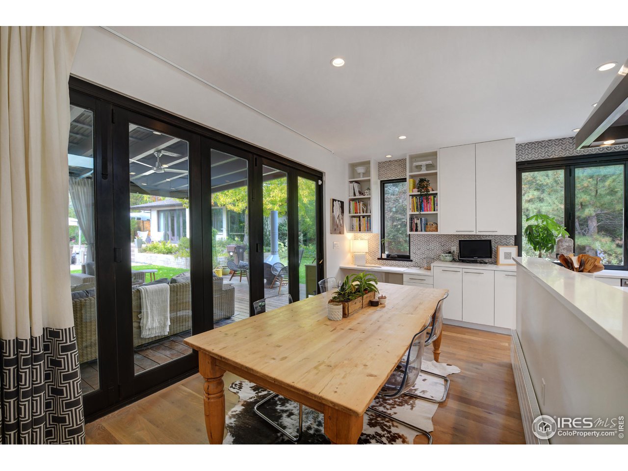 2115 Linden Avenue Boulder, CO 80304 - Photo 14 of 40 a living room with stainless steel appliances kitchen island granite countertop furniture and a large window