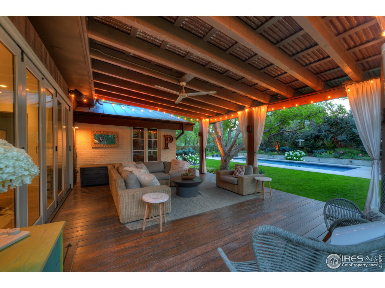2115 Linden Avenue Boulder, CO 80304 - Photo 15 of 40 a living room with patio furniture and garden
