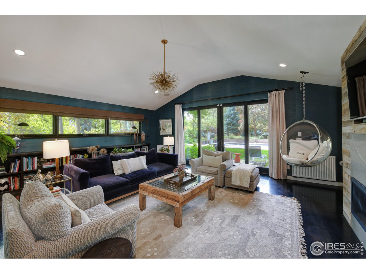2115 Linden Avenue Boulder, CO 80304 - Photo 19 of 40 a living room with furniture and a large window